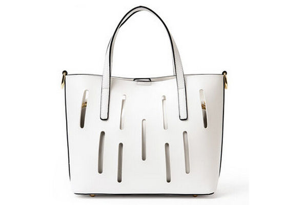 Unique hollow design Fashion Ladies Handbags solid anti wear nail on bottom