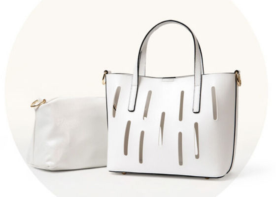 Unique hollow design Fashion Ladies Handbags solid anti wear nail on bottom